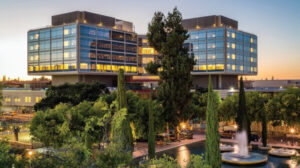 modern glass buildings at sunset